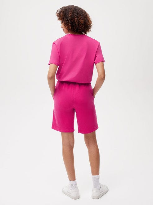 https://cdn.shopify.com/s/files/1/0035/1309/0115/products/365-Organic-Cotton-Long-Shorts-Foxglove-Pink-Female-2.jpg?v=1662476218&width=493