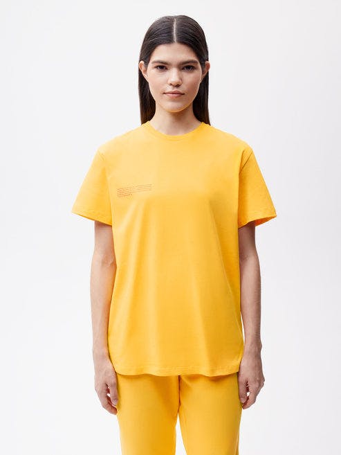https://cdn.shopify.com/s/files/1/0035/1309/0115/products/365-Organic-Cotton-Tshirt-Gingko-Yellow-Female-1.jpg?v=1664182506&width=493