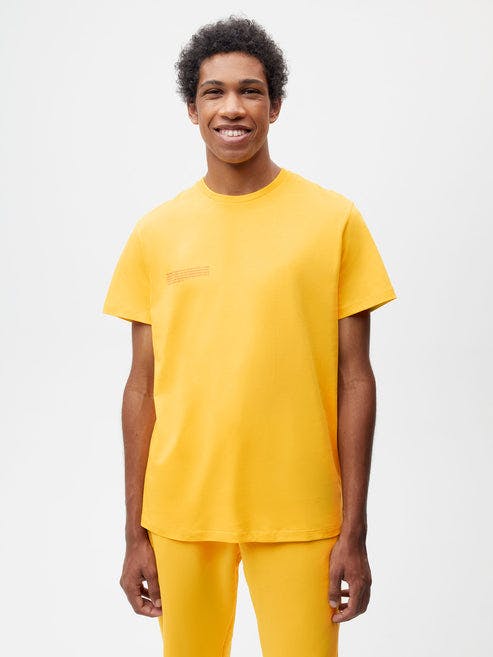 https://cdn.shopify.com/s/files/1/0035/1309/0115/products/365-Organic-Cotton-Tshirt-Gingko-Yellow-Male-1.jpg?v=1664182506&width=493