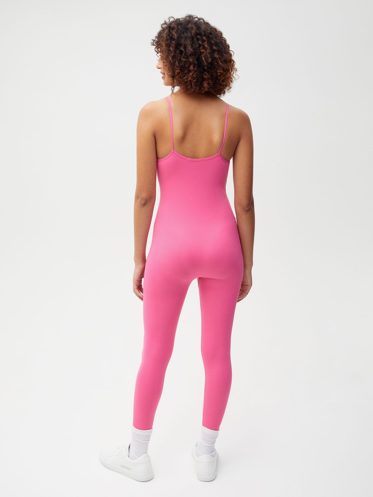 https://cdn.shopify.com/s/files/1/0035/1309/0115/products/Activewear-Womens-Jumpsuit-Flamingo-Pink-2_f6bcc789-0bc4-4f3c-b9df-b18058beb13c.jpg?v=1662475876