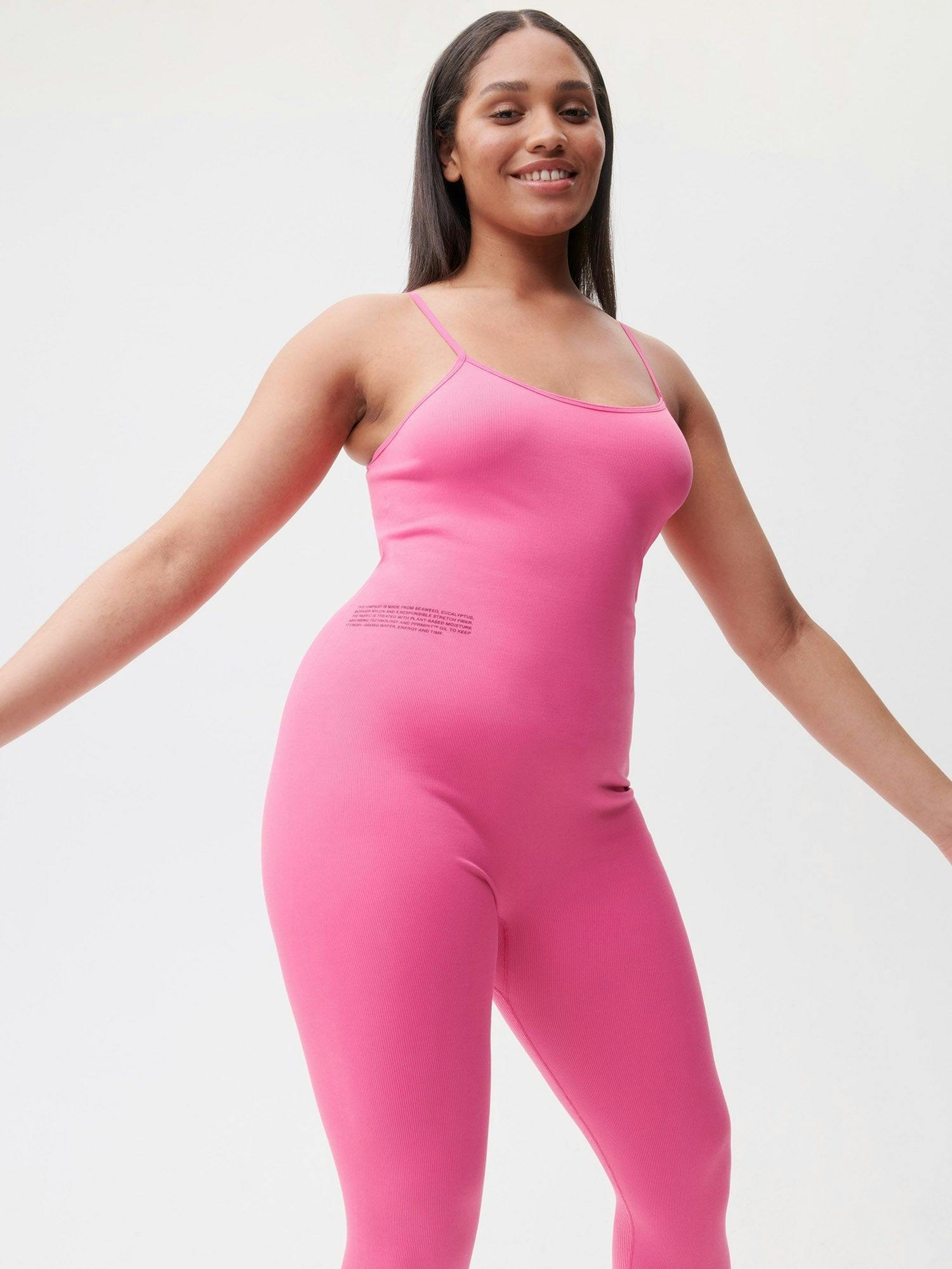 https://cdn.shopify.com/s/files/1/0035/1309/0115/products/Activewear-Womens-Jumpsuit-Flamingo-Pink-4bis.jpg?v=1662475874