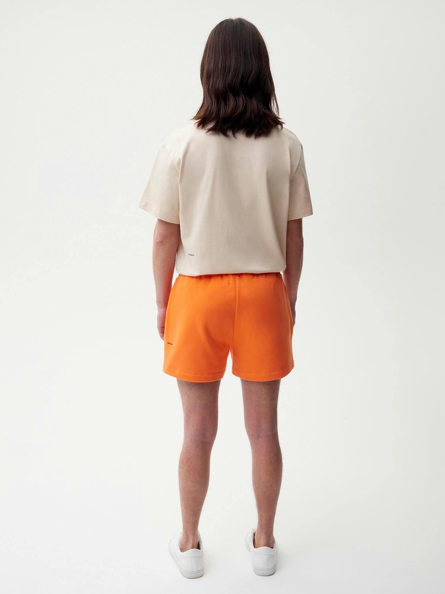 https://cdn.shopify.com/s/files/1/0035/1309/0115/products/Organic-Cotton-Shorts-Persimmon-Orange-Male-2.jpg?v=1662475637