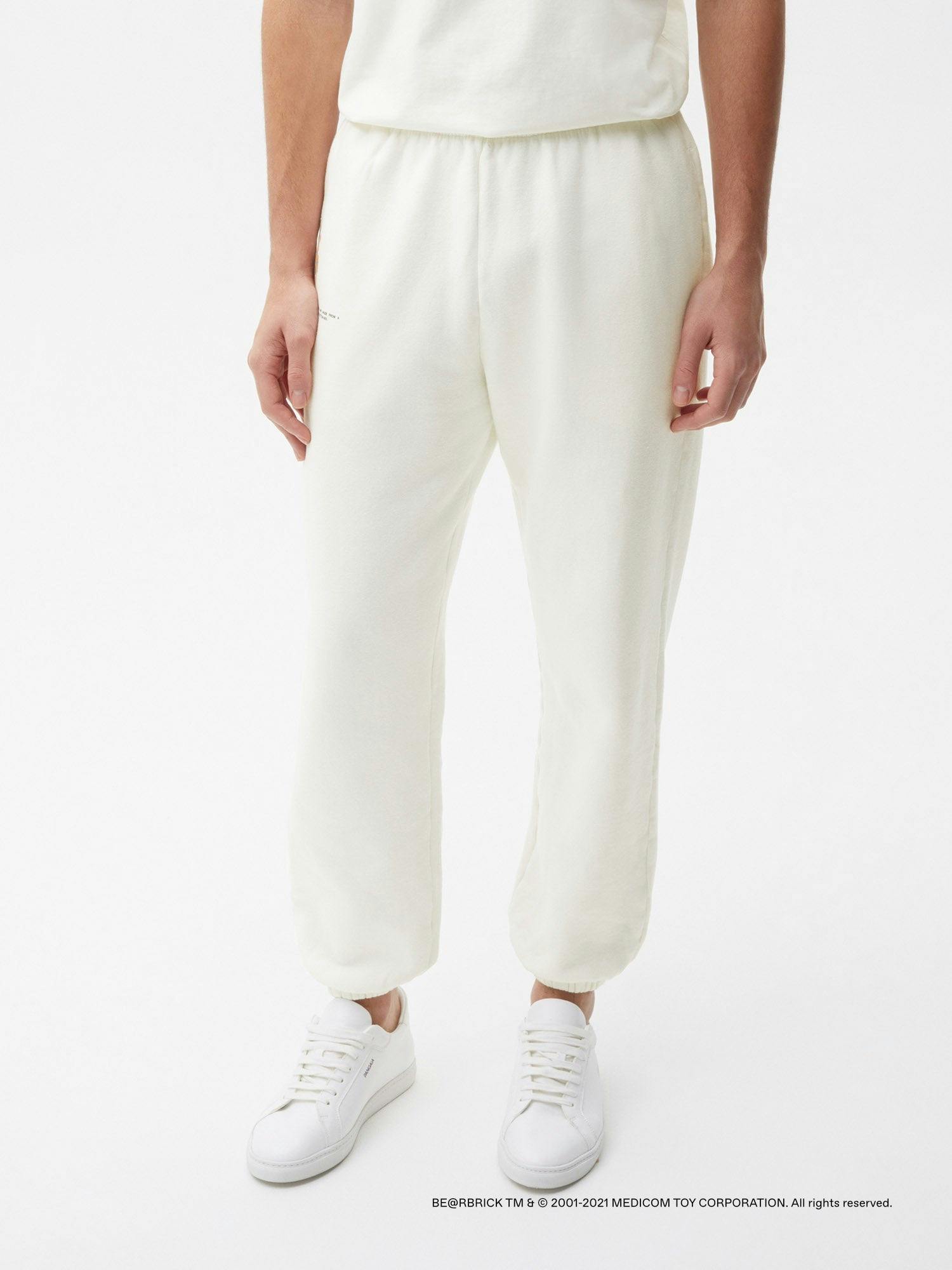 https://cdn.shopify.com/s/files/1/0035/1309/0115/products/Pangaia-Haroshi-Bearbrick-Heavyweight-Organic-Cotton-Track-Pants-Off-White-Male-1.jpg?v=1662475462