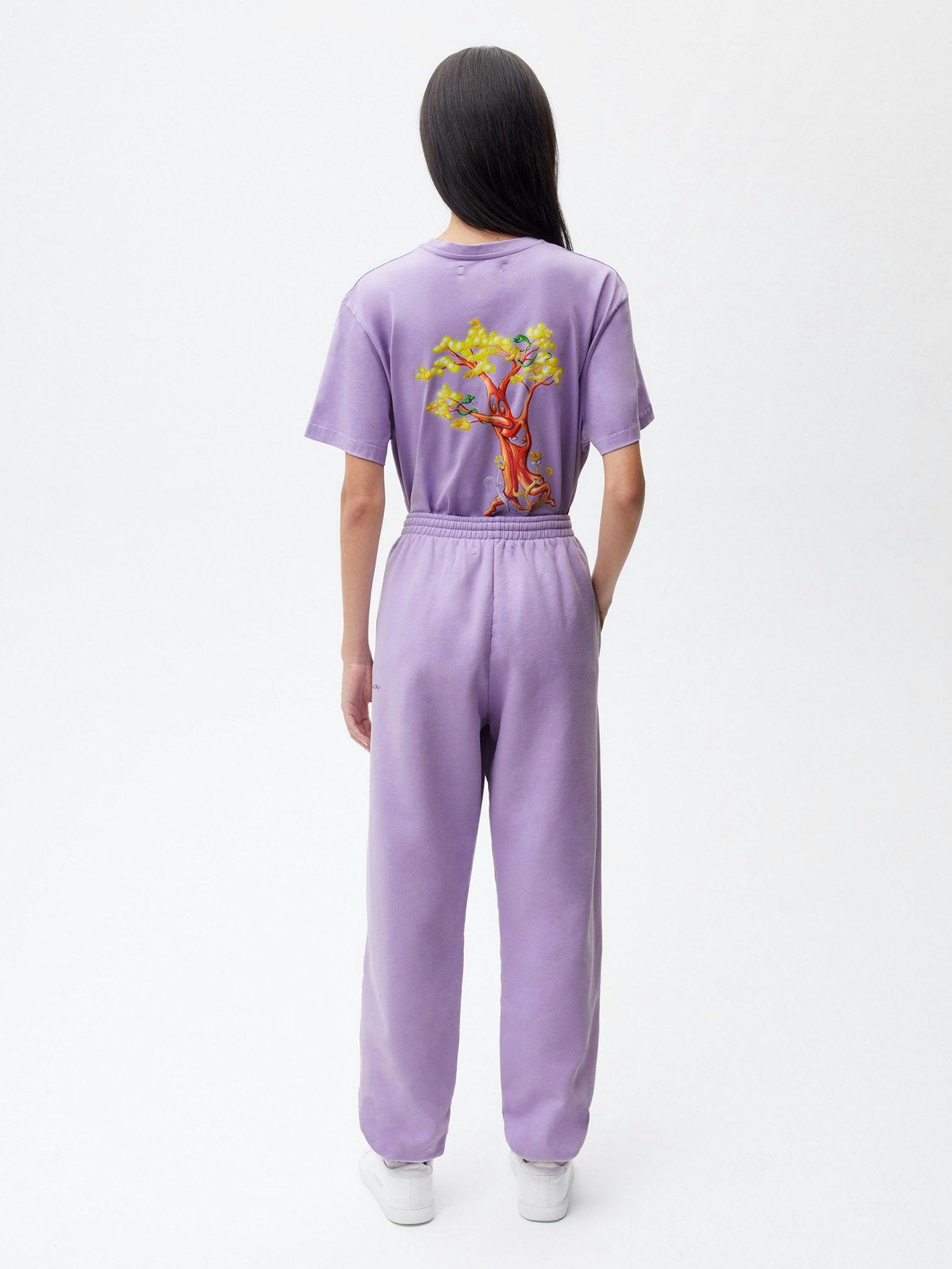 https://cdn.shopify.com/s/files/1/0035/1309/0115/products/Pangaia-Kenny-Scharf-365-Signature-Track-Pants-Paradis-Perdu-Orchid-Purple-Female-2.jpg?v=1662735693