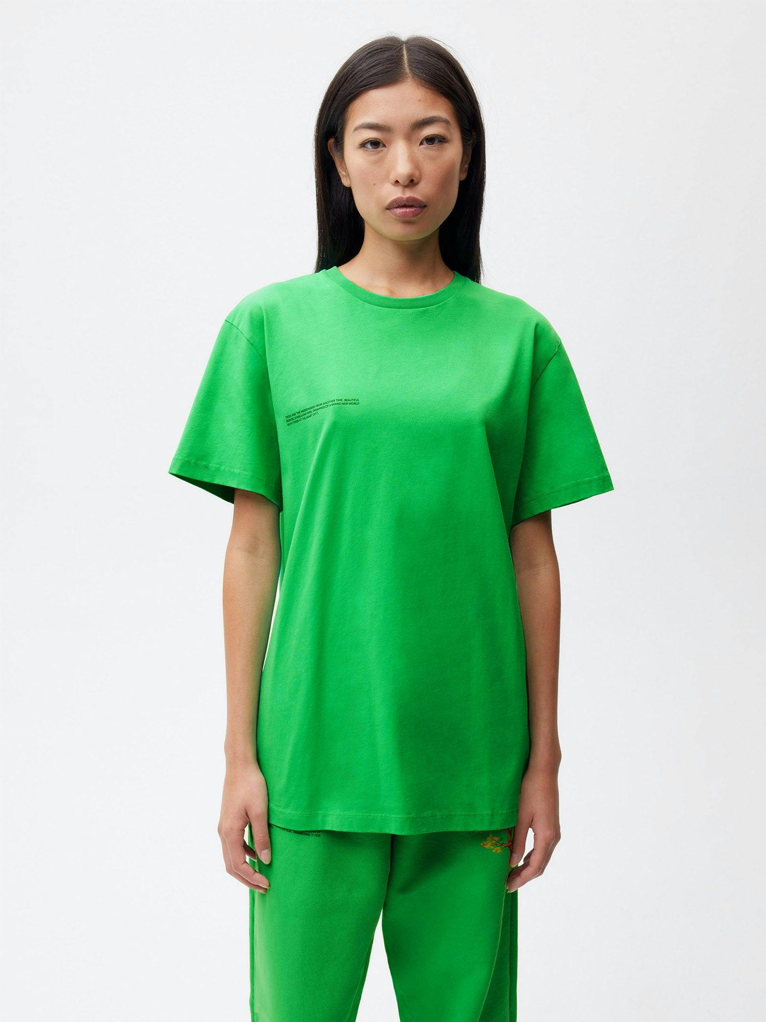 https://cdn.shopify.com/s/files/1/0035/1309/0115/products/Pangaia-Kenny-Scharf-Organic-Cotton-T-Shirt-Paradis-Perdu-Jade-Green-Female-1.jpg?v=1662734802