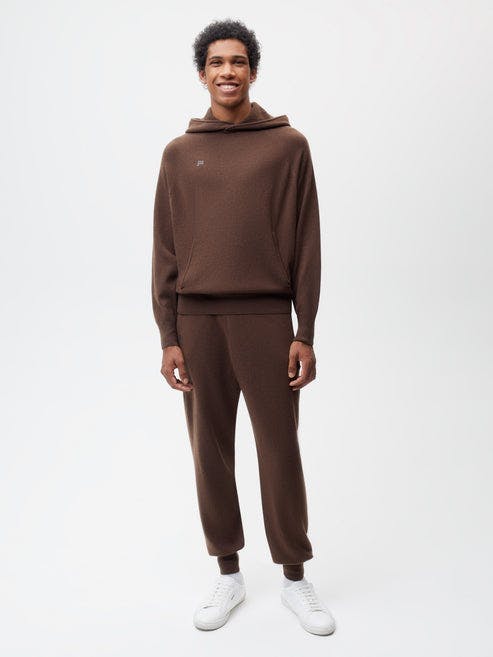 https://cdn.shopify.com/s/files/1/0035/1309/0115/products/Recycled-Cashmere-Core-Track-Pants-Chestnut-Brown-Male-1.jpg?v=1663947790&width=493