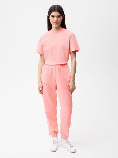https://cdn.shopify.com/s/files/1/0035/1309/0115/products/Recycrom-Track-Pants-Coral-Pink-Female-1.jpg?v=1662476547&width=493