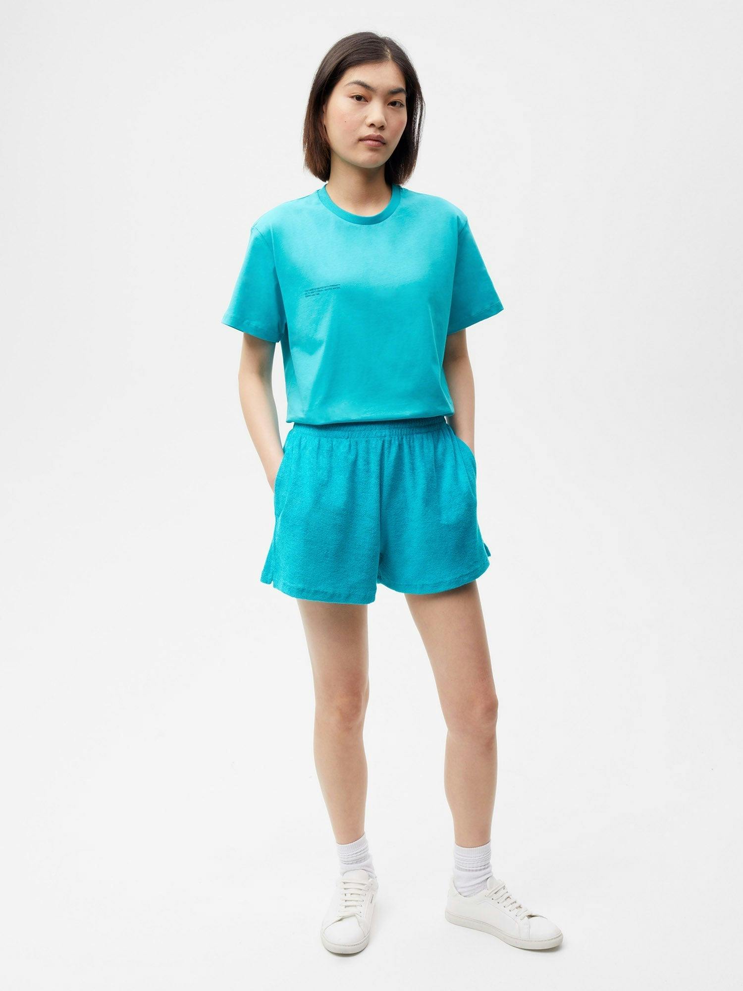 https://cdn.shopify.com/s/files/1/0035/1309/0115/products/Towelling-Organic-Cotton-Short-Shorts-Peacock-Blue-Female-1.jpg?v=1662476500